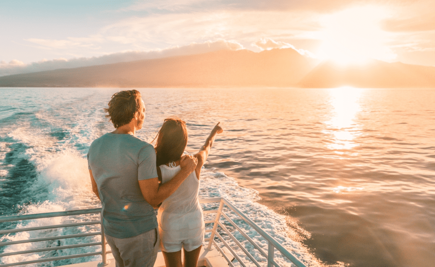 Couple watching sunset in Maldives