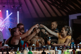 Group of friends enjoying drinks at Bandos Maldives Resort