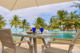 Beachside dining with tropical pool view in Maldives