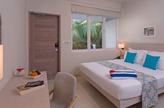 Cozy tropical resort room with modern decor and views