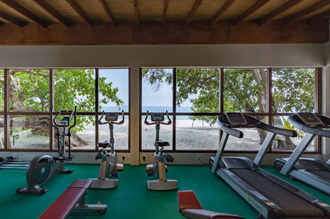 Beachfront gym with ocean views and modern equipment