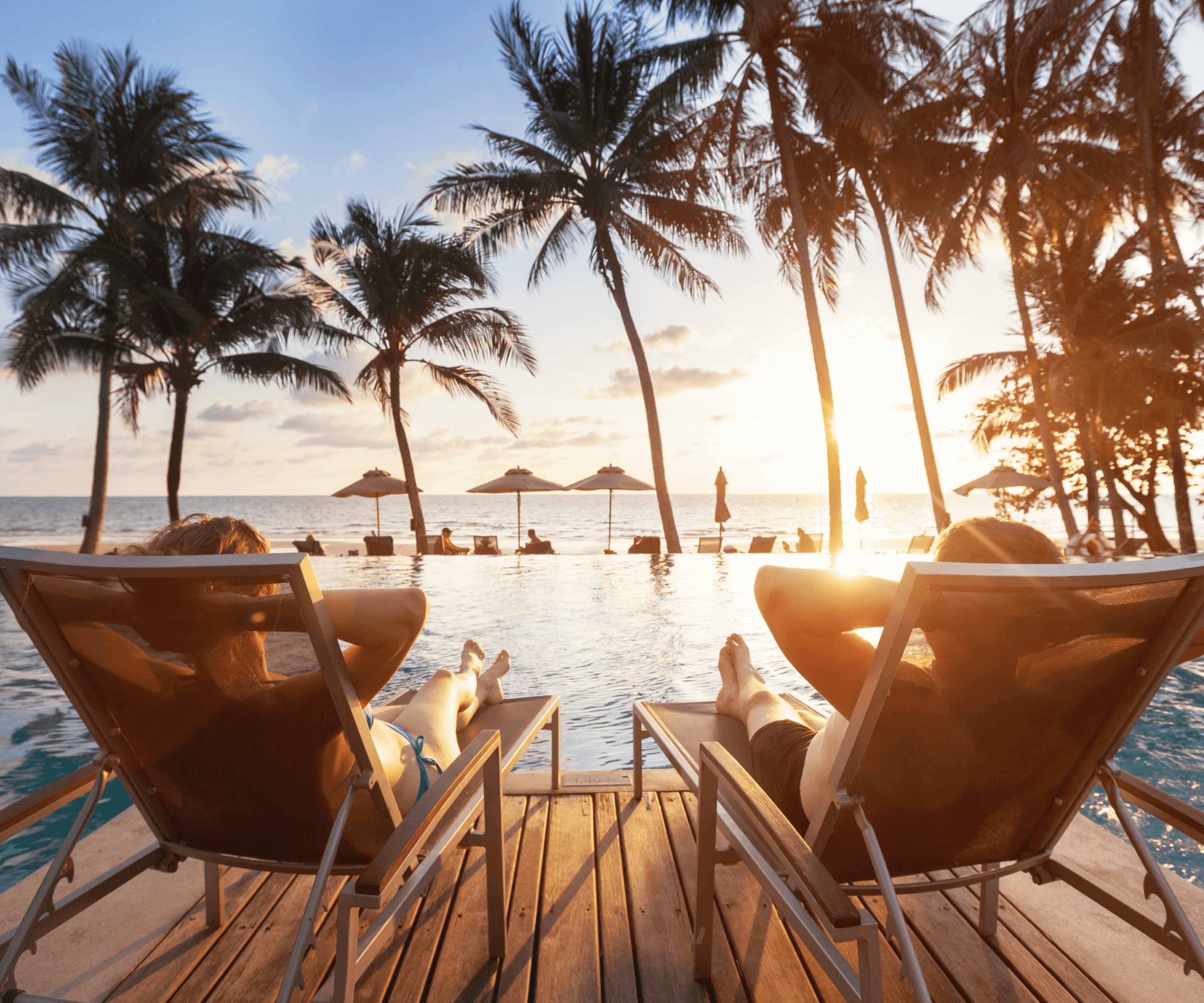 Relaxing by the pool with ocean view at sunset